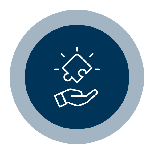 Hand holding a puzzle piece icon on a dark blue circular background.