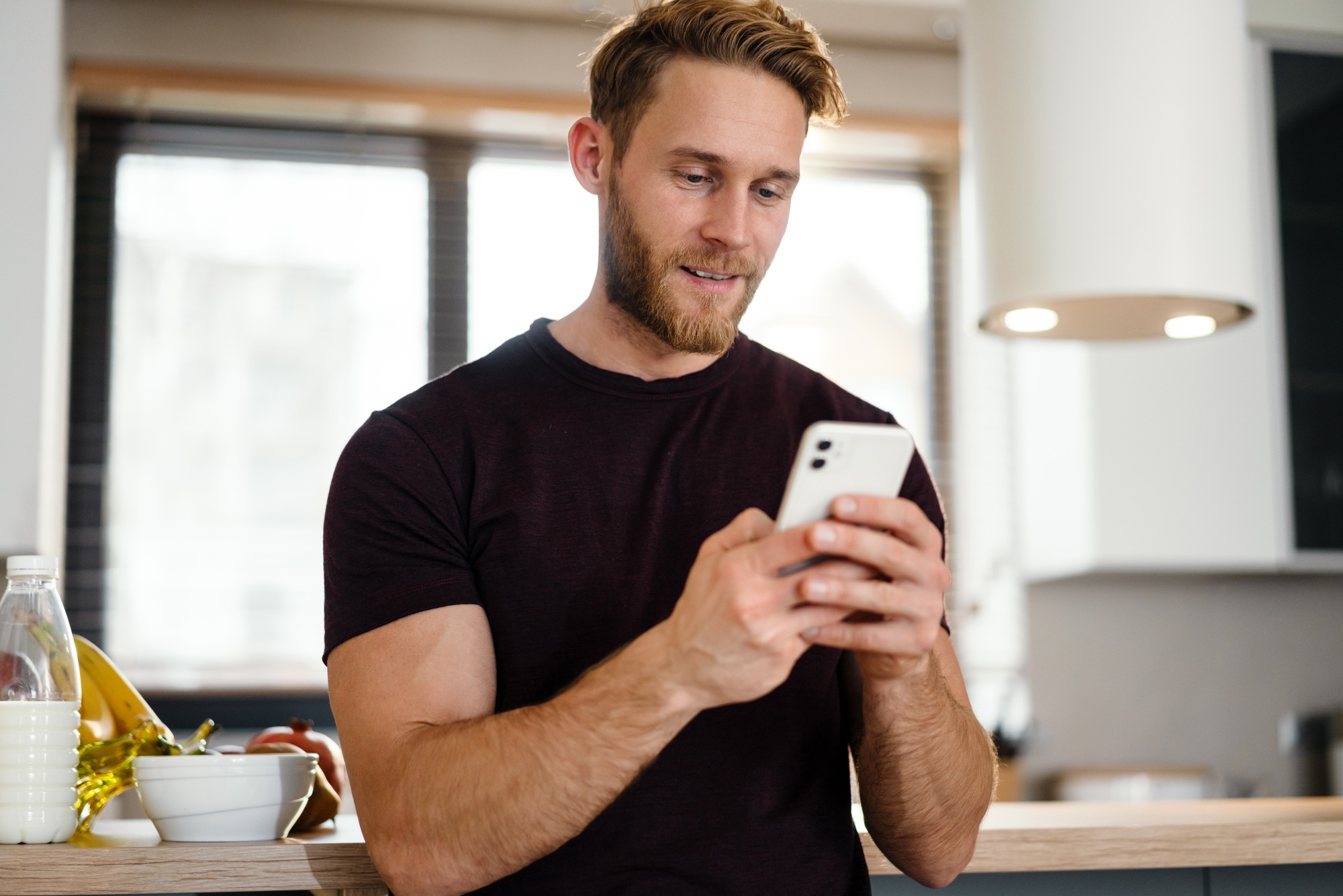 Handsome young man using mobile phone